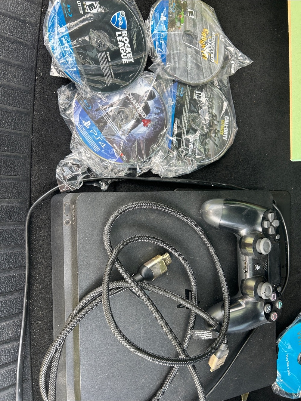 Sony Black PlayStation 4 Slim with Controller and Game Discs